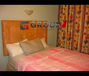 Bedroom 1 fully tiled with seaviews