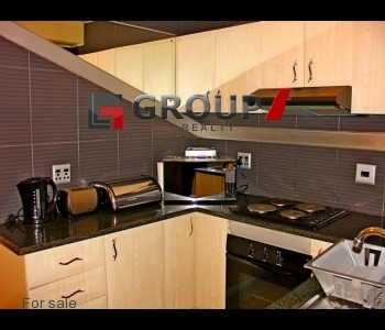 Kitchen tiled with granite tops