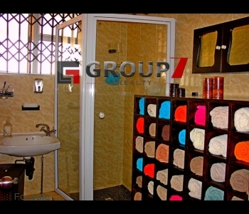 Bathroom 1 fully tiled with shower
