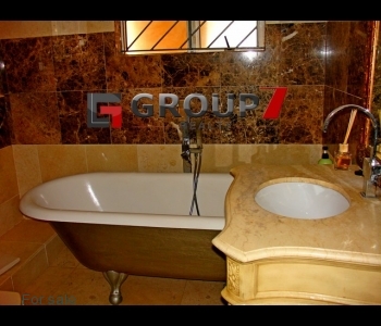 Bathroom with large bath tub