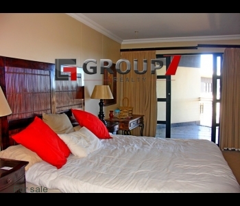 Bedroom 2  with balcony and built-in cupboards