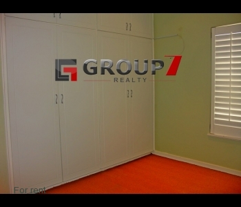 Bedroom 2 carpeted with built-in cupboards.