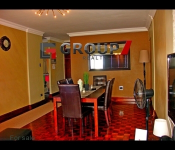 Open plan dining area with gleaming parquet floors