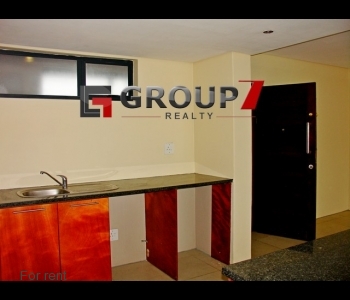 Open plan kitchen plumbed for washing machine and dryer