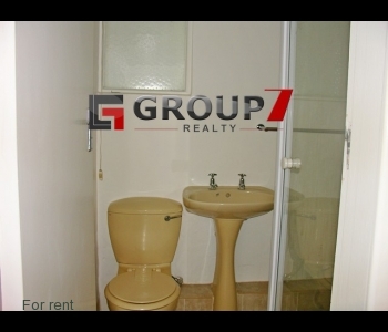 En-suite bathroom tiled with shower