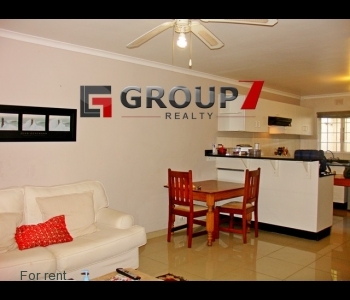 Open plan lounge with porcelain tiles