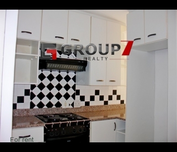 Kitchen with defy oven, hob and extractor