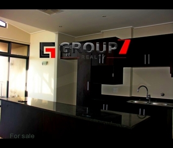 Open plan kitchen with granite tops