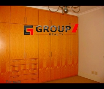 Bedroom with wall to wall built-in cupboards