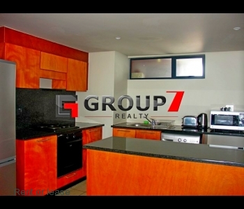 Open plan kitchen with granite tops