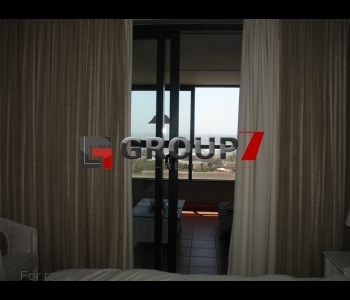 Bedroom leading onto enclosed balcony