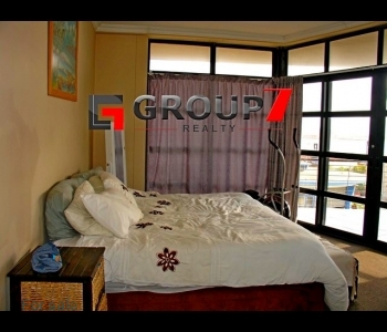 Bedroom with double volume windows for enjoying the views