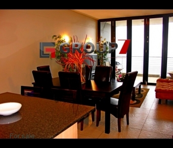 Open plan living area leading onto balcony