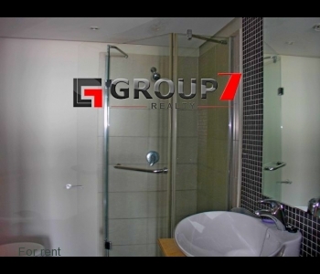Bathroom fully tiled with shower