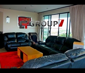 Open plan lounge with double volume windows