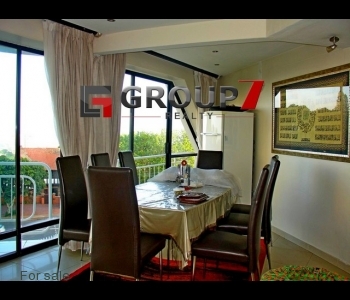 Open plan dining with expansive windows and views