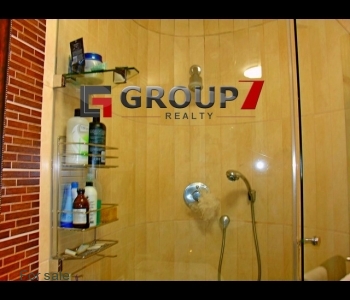 Fully tiled bathroom with shower