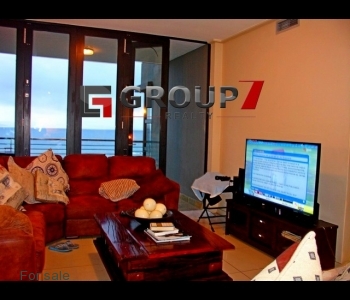 Open plan lounge with sea views