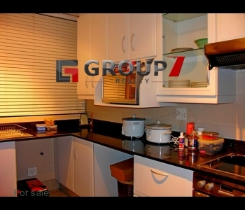 Kitchen with granite tops and plumbed for washing machine