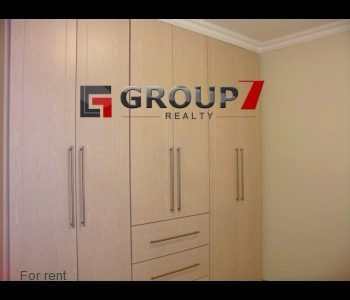 Bedroom with wall to wall built-in cupboards
