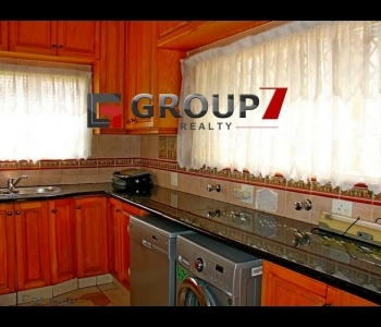 Kitchen fitted with washing machine and tumble dryer